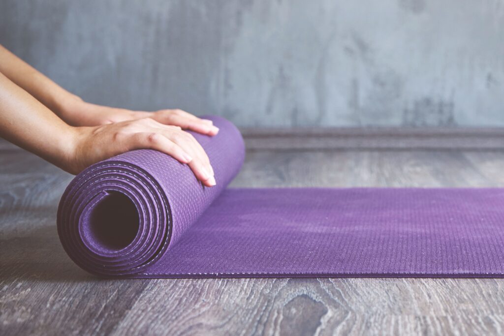 Rolled yoga mat for a wellness Yoga activity